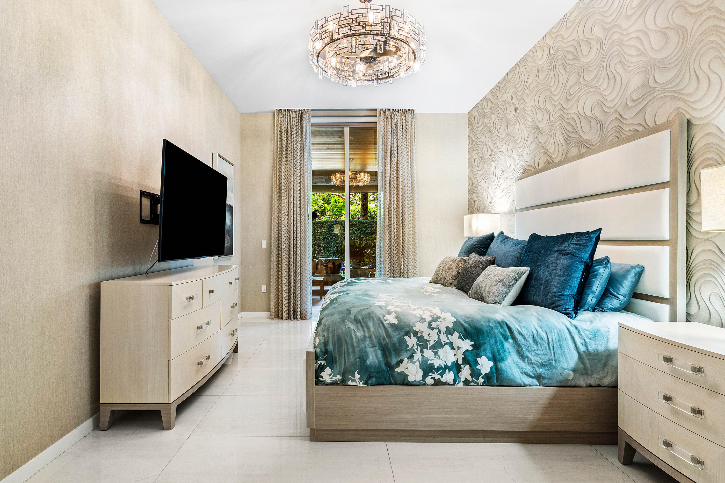 200 Southeast Mizner Boulevard, Unit 104 Boca Raton, FL 33432 - Photo 13 of 82 a living room with furniture and flat screen tv