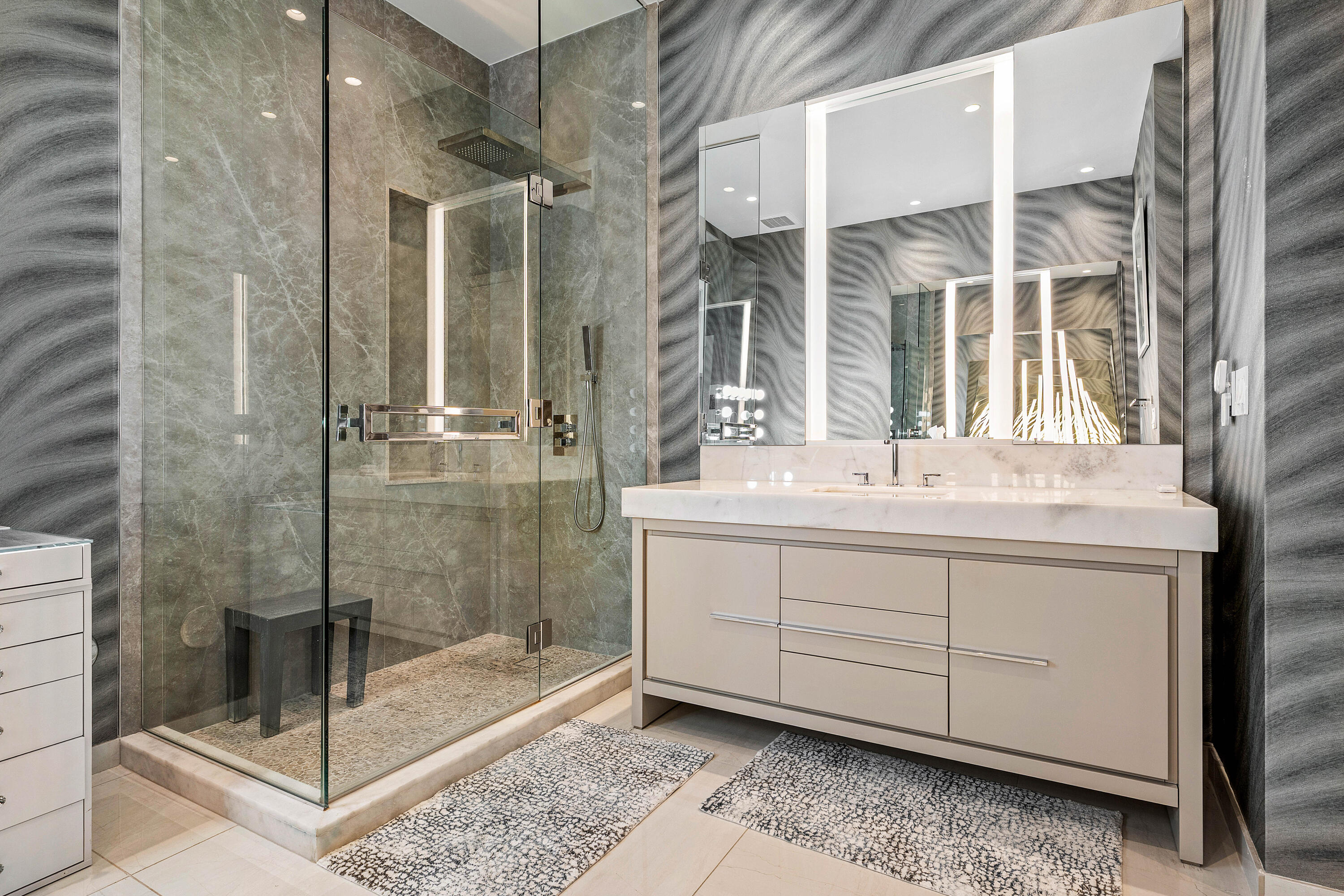 200 Southeast Mizner Boulevard, Unit 104 Boca Raton, FL 33432 - Photo 18 of 82 a bathroom with a shower sink and mirror