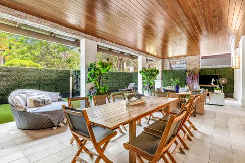 a view of a living room and floor to ceiling window or kitchen