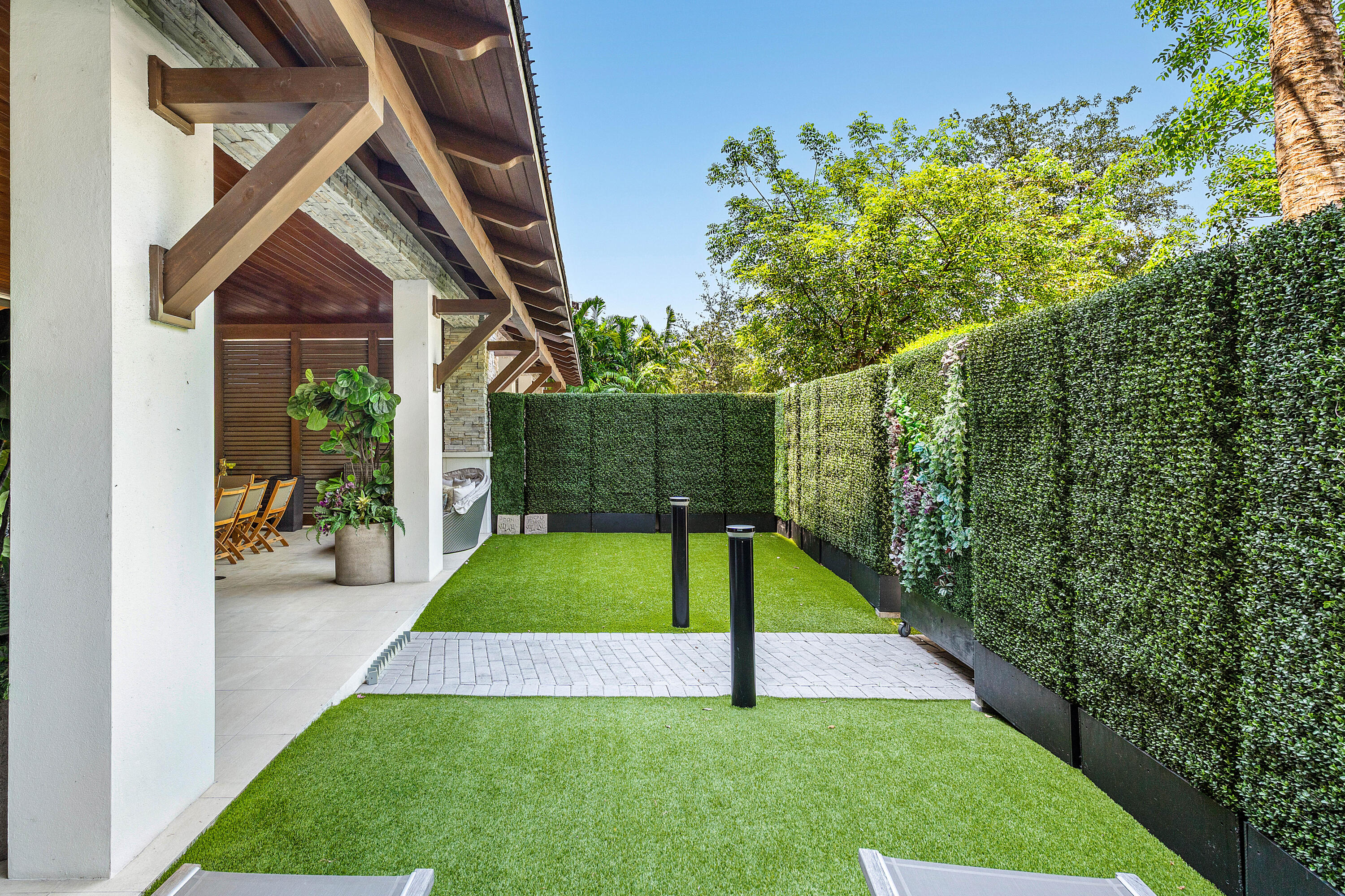 200 Southeast Mizner Boulevard, Unit 104 Boca Raton, FL 33432 - Photo 27 of 82 a view of an house with backyard space and garden