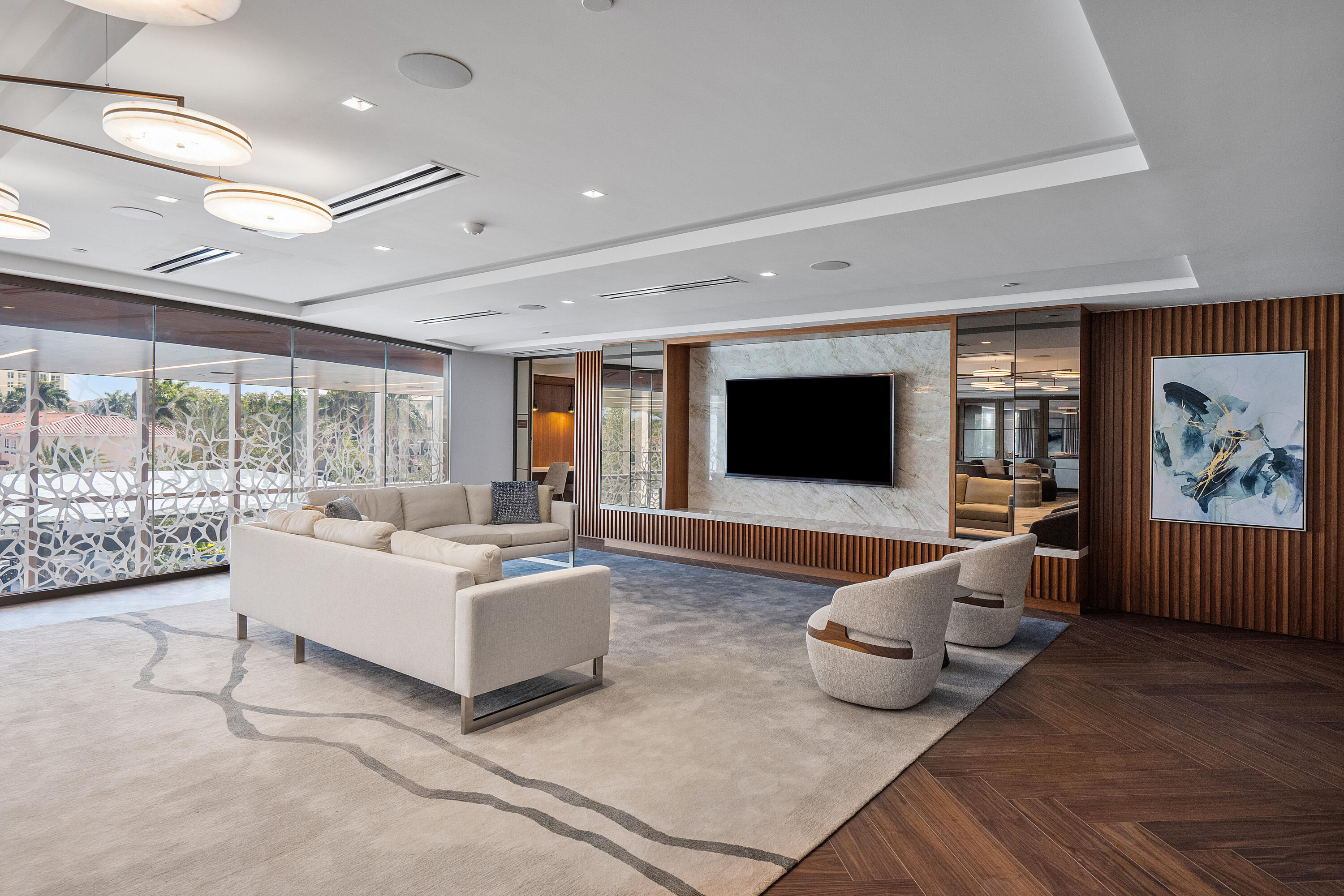 200 Southeast Mizner Boulevard, Unit 104 Boca Raton, FL 33432 - Photo 61 of 82 a living room with furniture and a flat screen tv