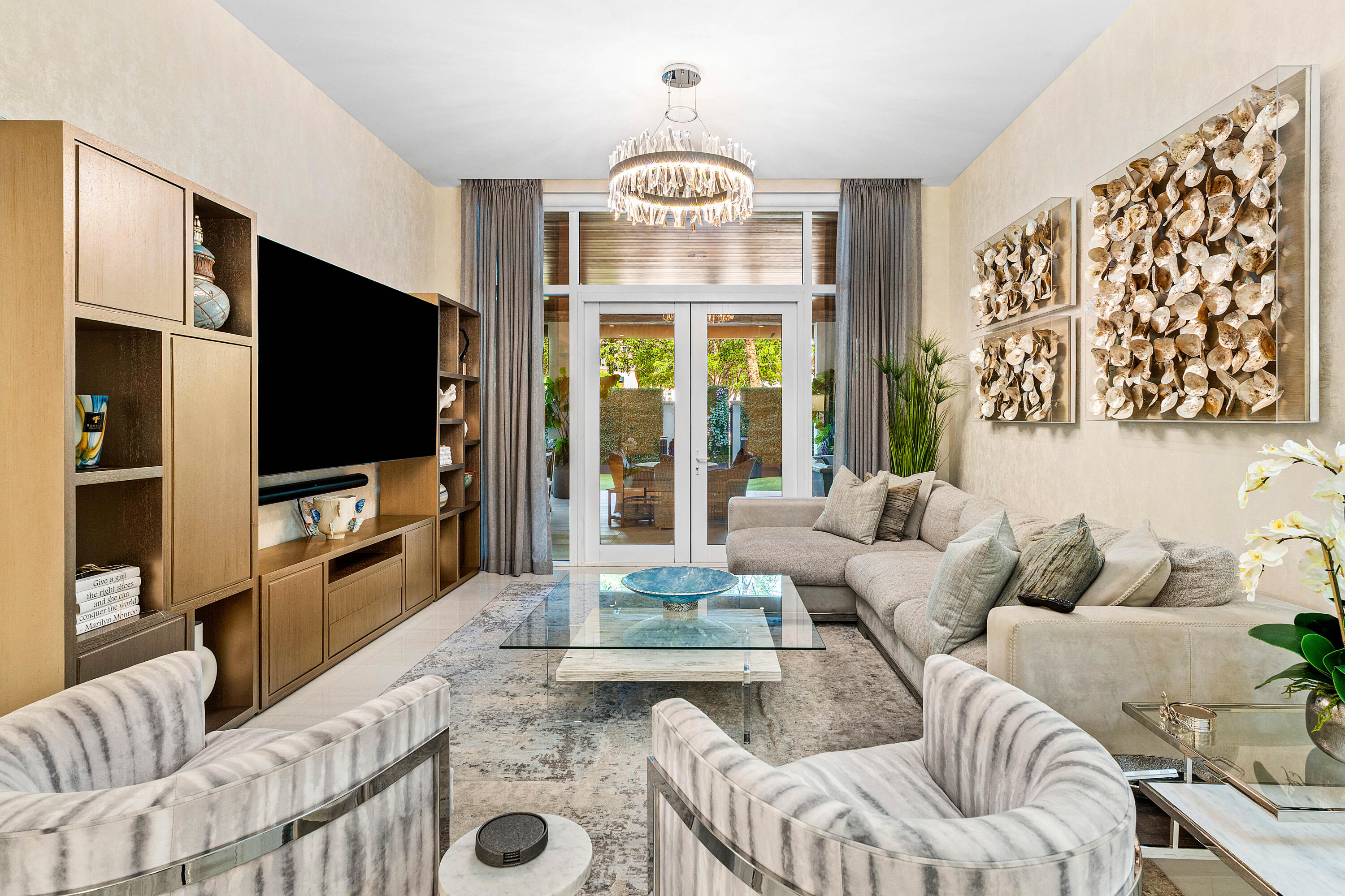 200 Southeast Mizner Boulevard, Unit 104 Boca Raton, FL 33432 - Photo 9 of 82 a living room with fireplace furniture and a flat screen tv