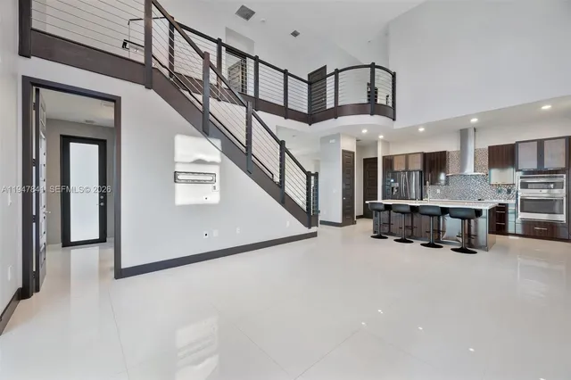 a view of a hallway with seating space