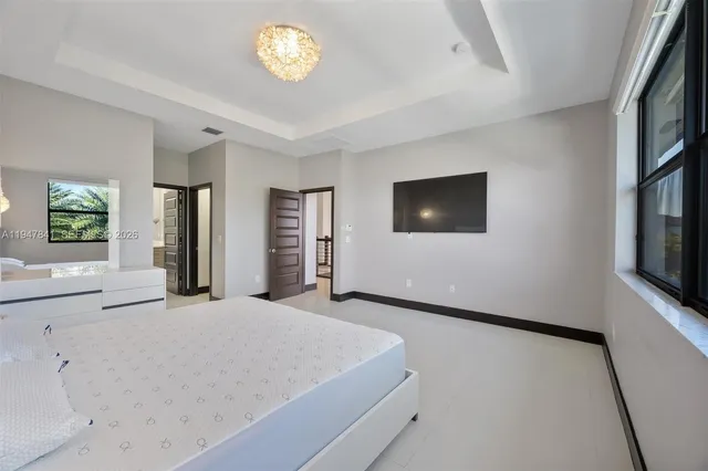 a spacious bathroom with a granite countertop sink mirror and double