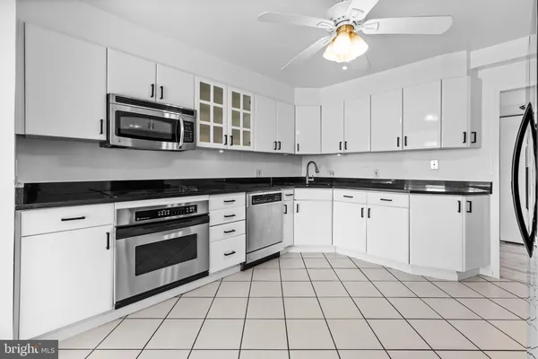 a view of a livingroom with a kitchen