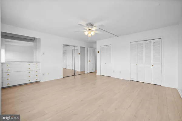 a view of an empty room with glass door