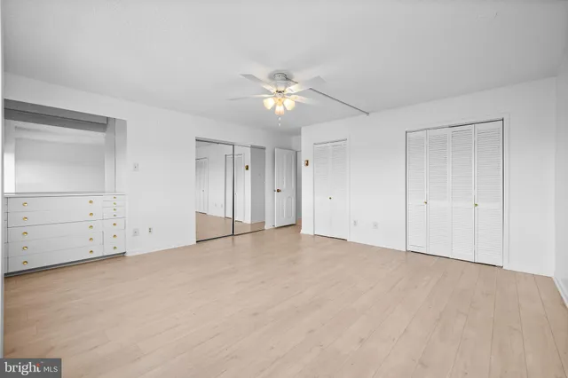 a view of an empty room with glass door