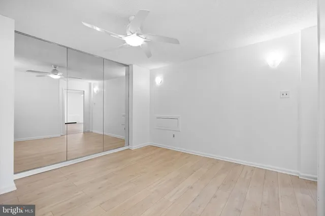 a bathroom with a shower and a glass door