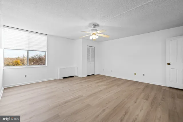 a bathroom with a sink a toilet a mirror and bathtub