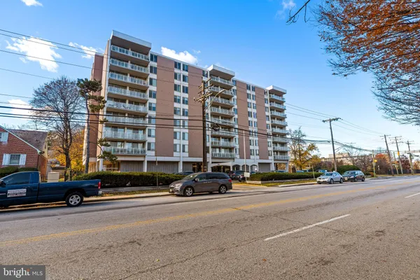 a city street lined with buildings and cars