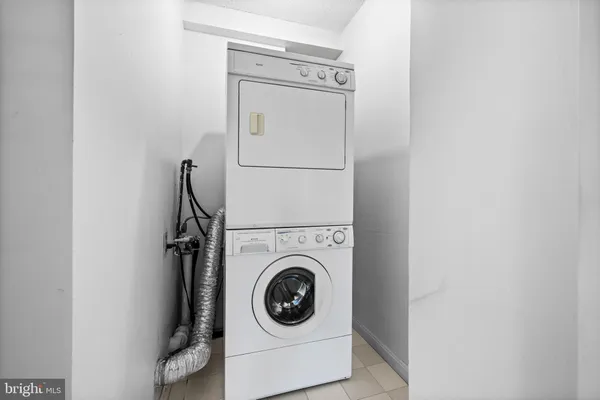 a view of a walk in closet and city view