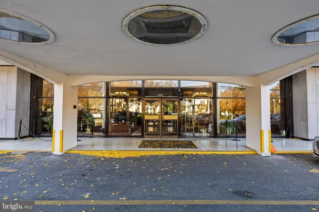 a view of a kitchen with a sink and refrigerator
