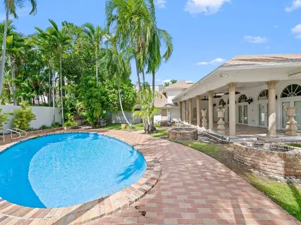 a view of a swimming pool with a patio