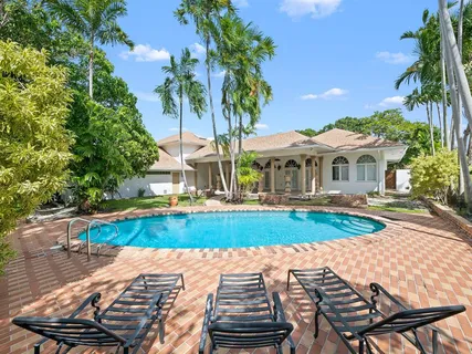 a view of swimming pool with a garden