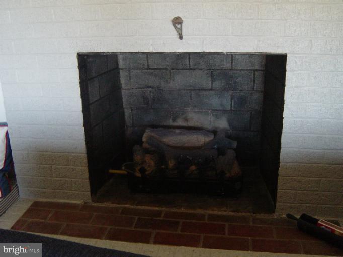6115 Twin Point Cove Road Cambridge, MD 21613 - Photo 15 of 28 Living Room with fireplace