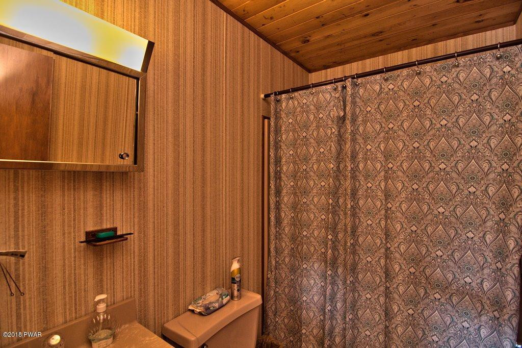 2327 Brookfield Road Lake Ariel, PA 18436 - Photo 12 of 53 a bathroom with a shower curtain