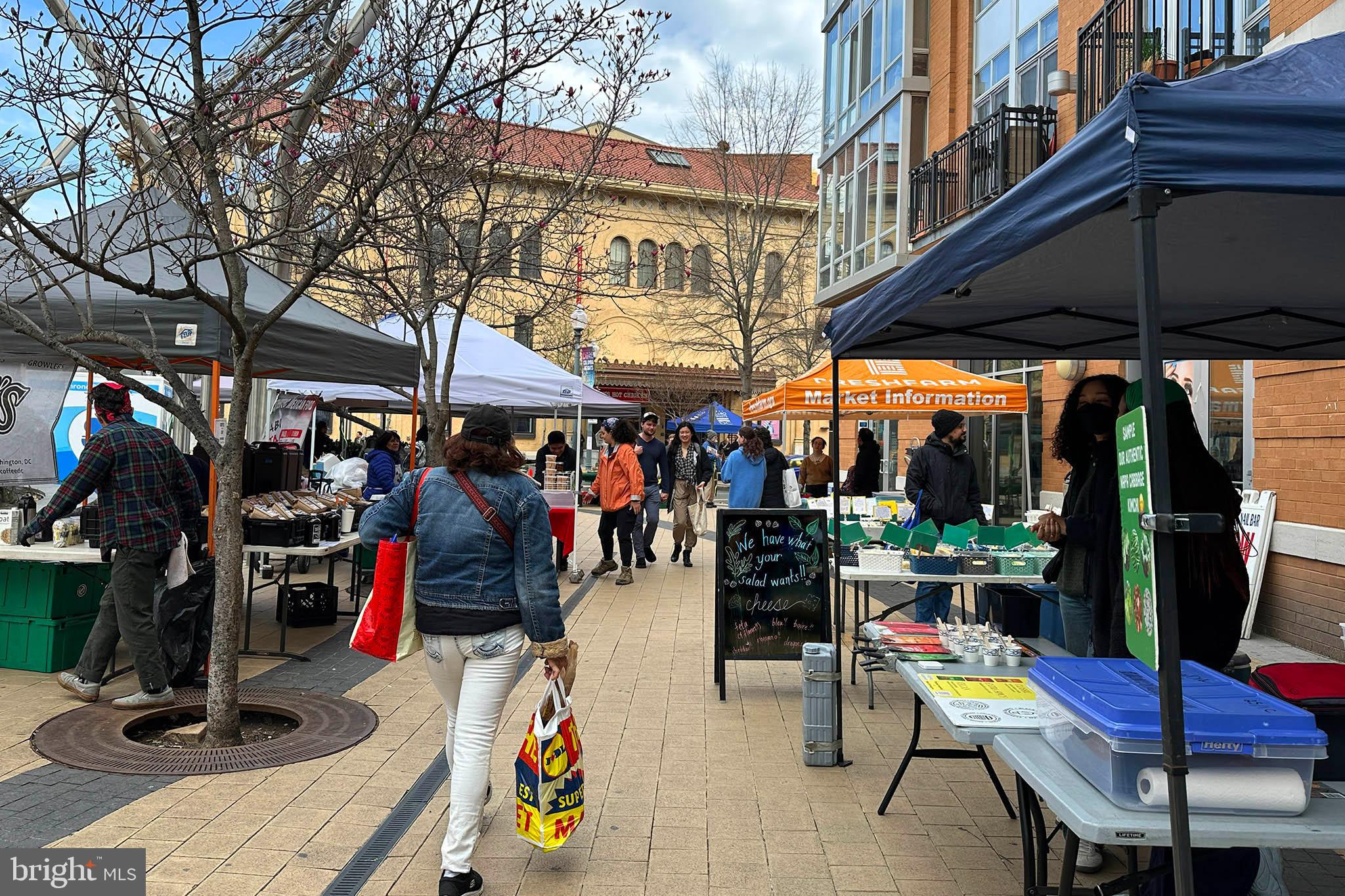 1451 Park Road Northwest, Unit 104 Washington, DC 20010 - Photo 17 of 28 a view of people sitting in front of shop