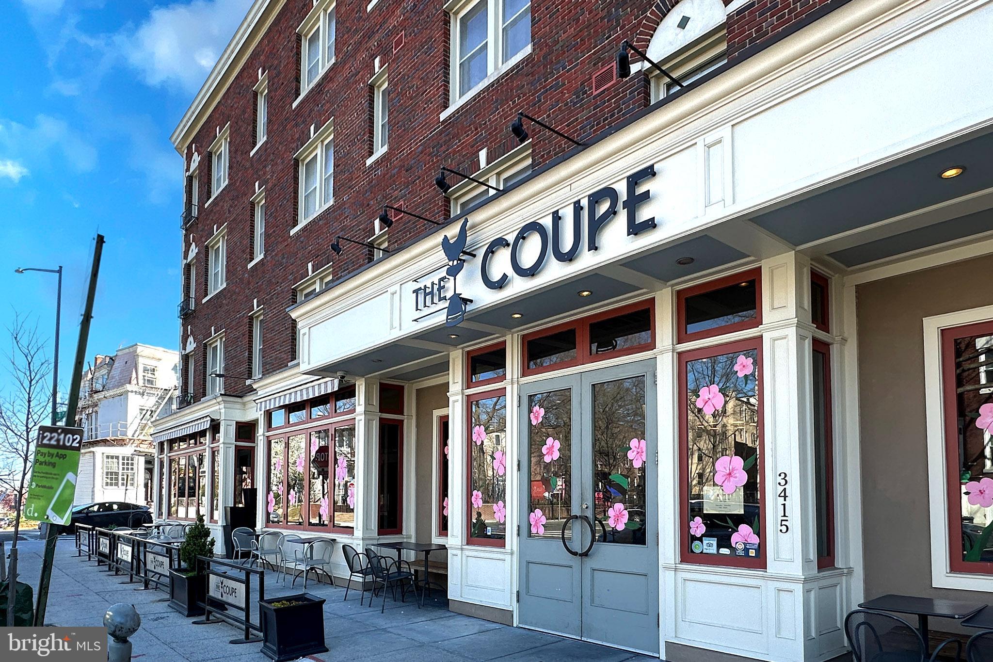 1451 Park Road Northwest, Unit 104 Washington, DC 20010 - Photo 25 of 28 a front view of multi story building with retail shops