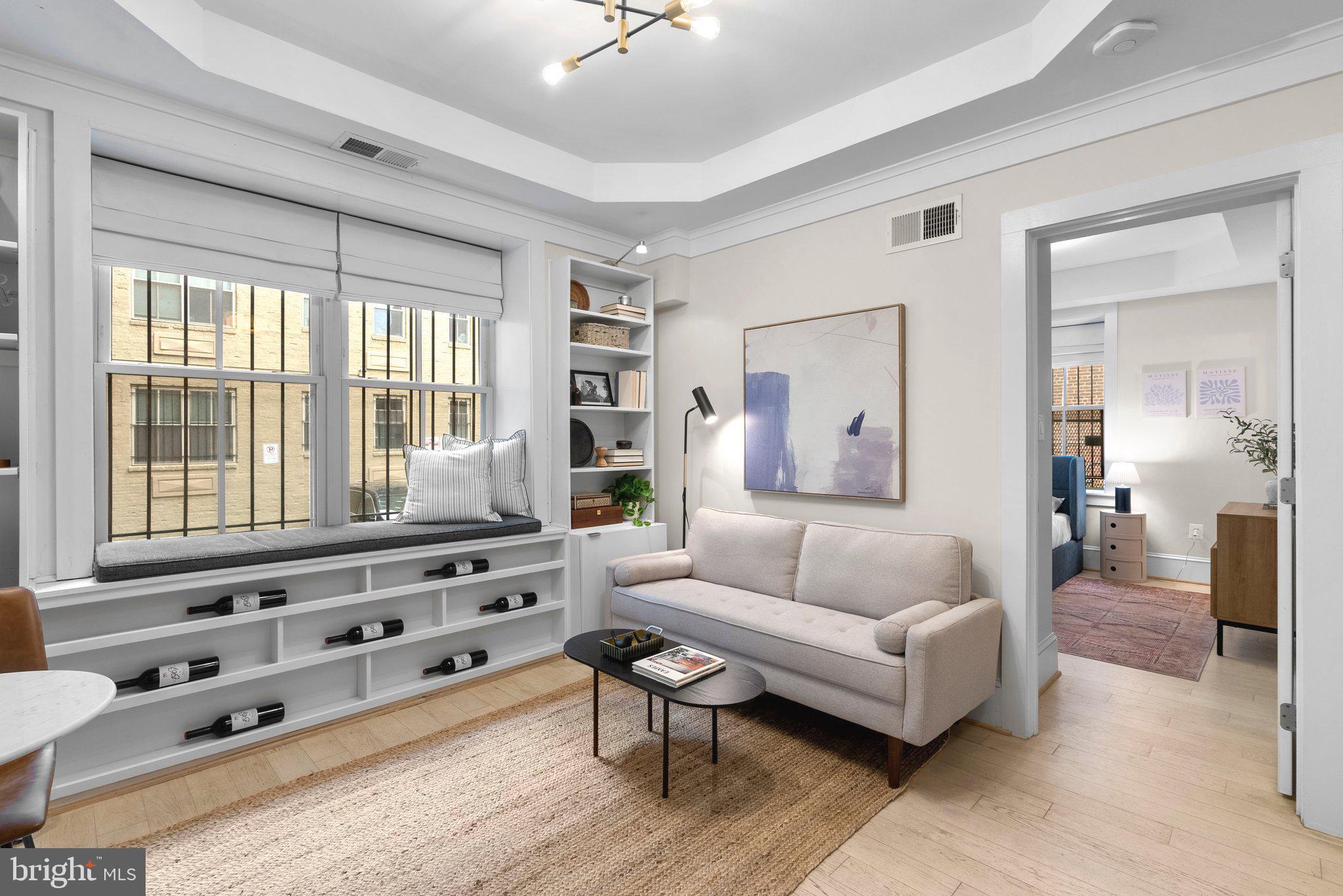 1451 Park Road Northwest, Unit 104 Washington, DC 20010 - Photo 4 of 28 a living room with furniture and wooden floor
