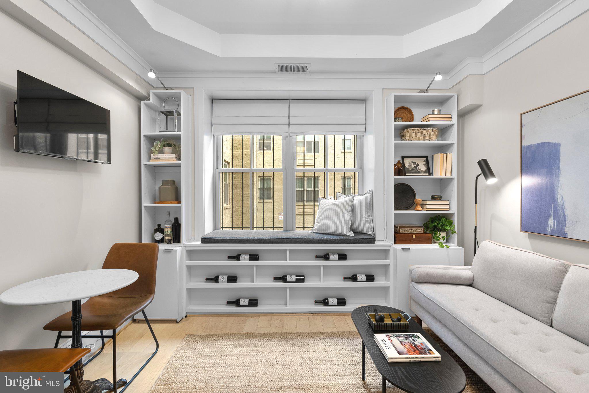 1451 Park Road Northwest, Unit 104 Washington, DC 20010 - Photo 5 of 28 a living room with furniture and a flat screen tv