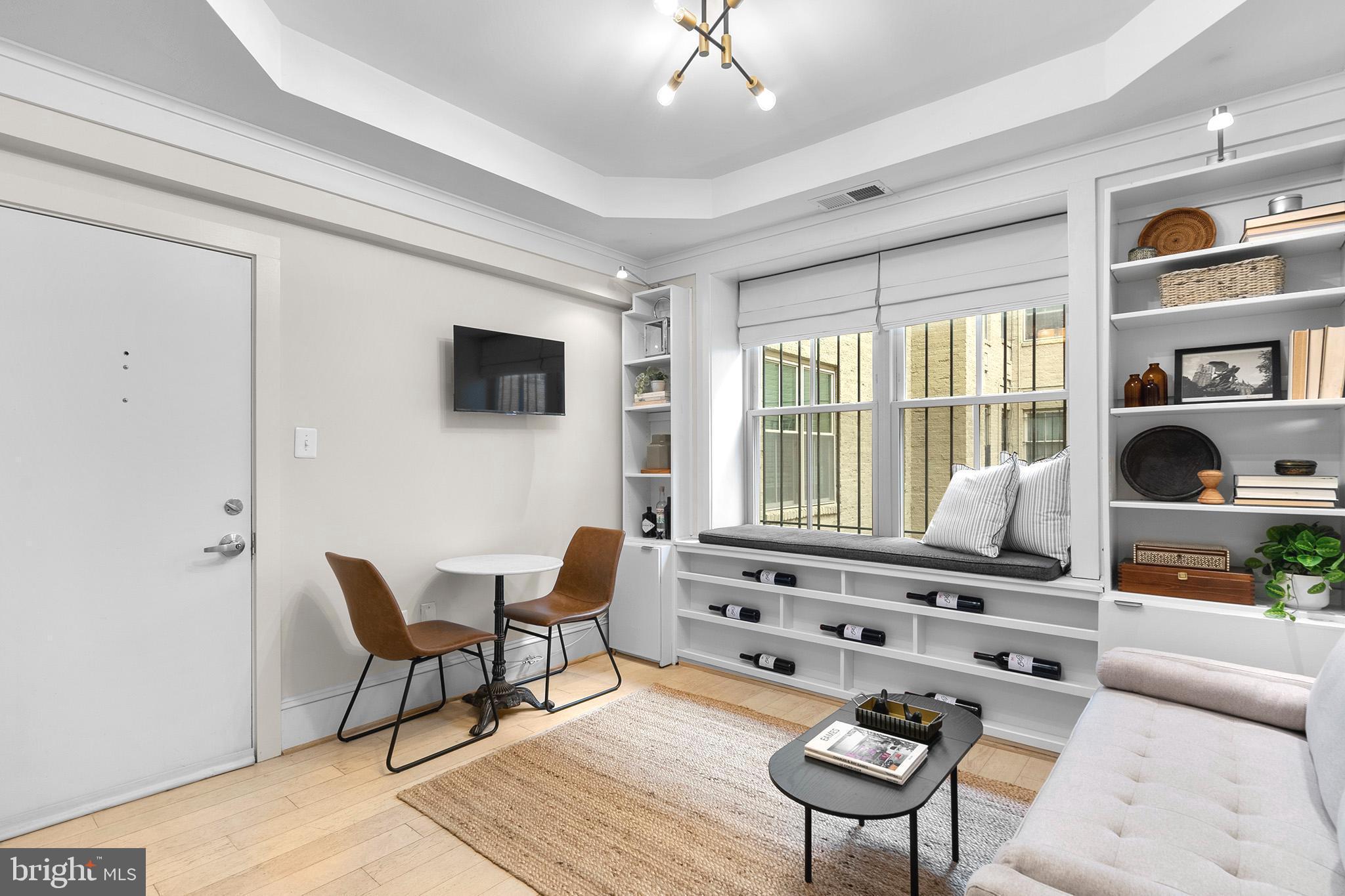 1451 Park Road Northwest, Unit 104 Washington, DC 20010 - Photo 6 of 28 a living room with furniture and a window
