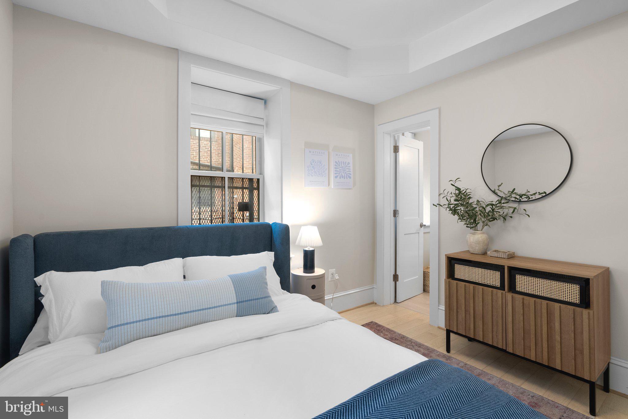 1451 Park Road Northwest, Unit 104 Washington, DC 20010 - Photo 9 of 28 a bedroom with a bed and window