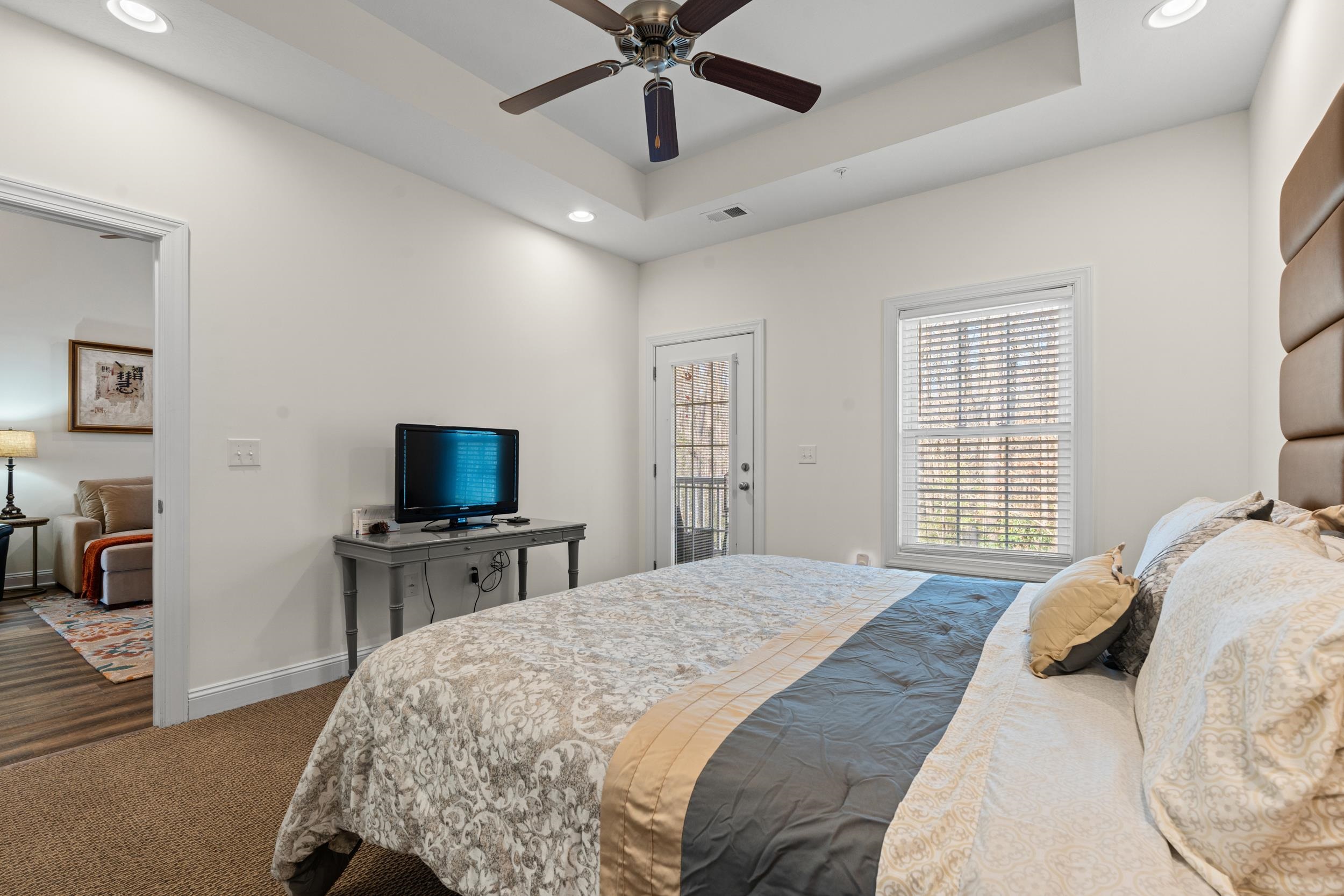 900 Jackline Place, Unit 202 Murrells Inlet, SC 29576 - Photo 26 of 39 Bedroom featuring recessed lighting, access to outside, a raised ceiling, ceiling fan, and carpet floors
