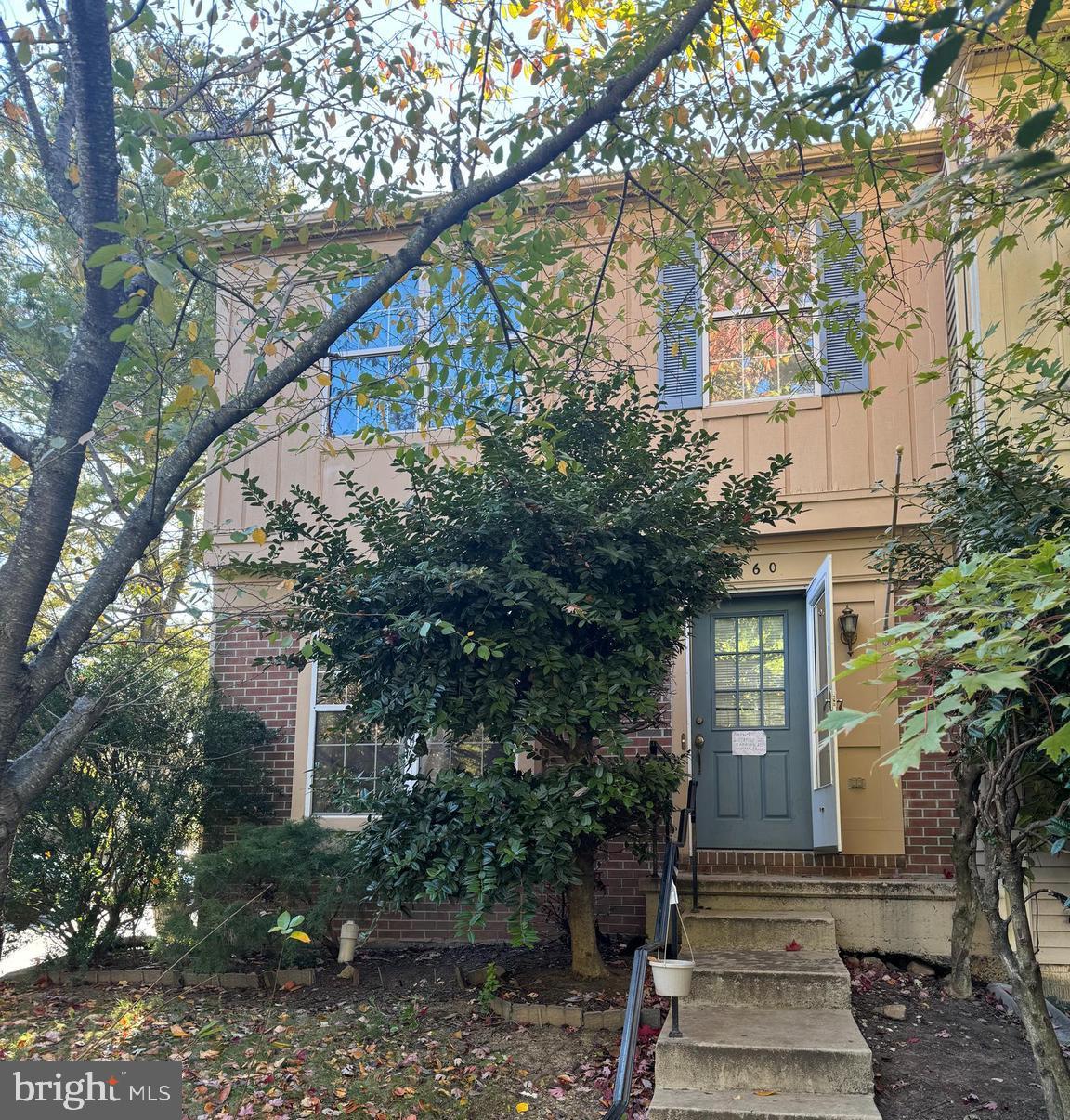 7860 Rebel Walk Drive Manassas, VA 20109 - Photo 1 of 1 a front view of a house with trees