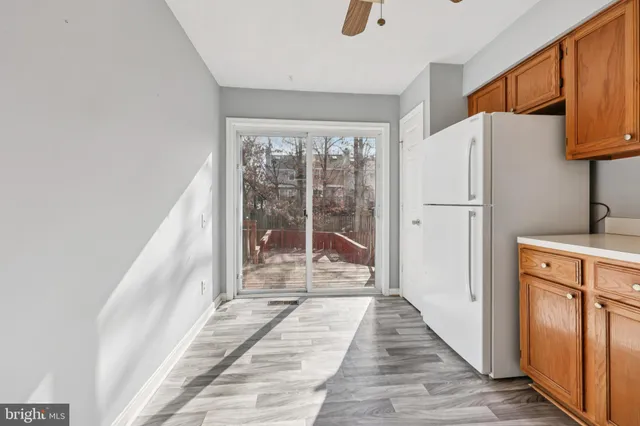 a view of a storage & utility room with refrigerator