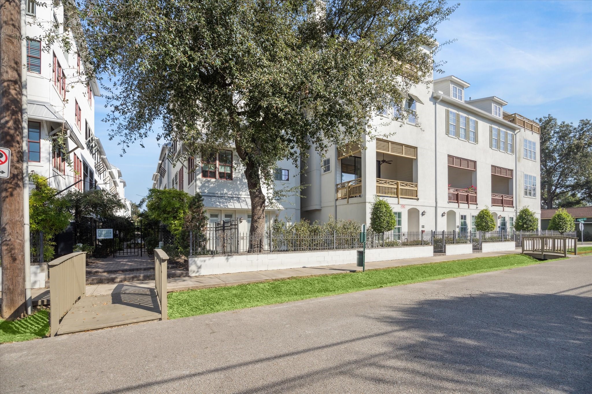 2714 Harvard Street Houston, TX 77008 - Photo 1 of 31 a view of a building with a bench in front of it