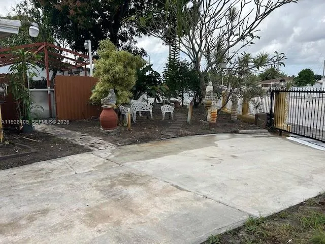 a view of a backyard of the house