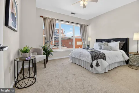 a bedroom with a bed and window