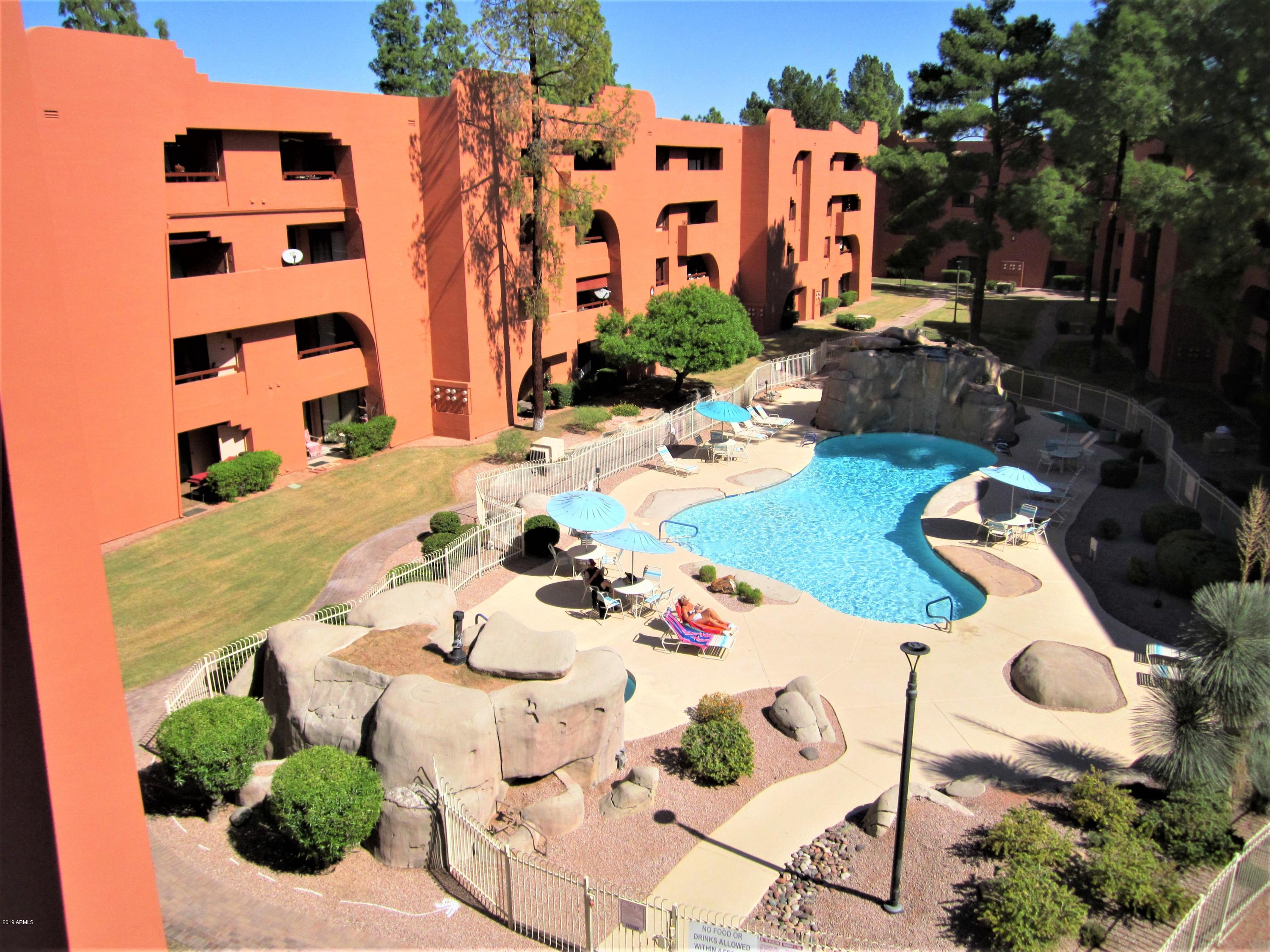 4303 East Cactus Road, Unit 406 Phoenix, AZ 85032 - Photo 13 of 27 B7-406 VIEW OF POOL 2 BELOW