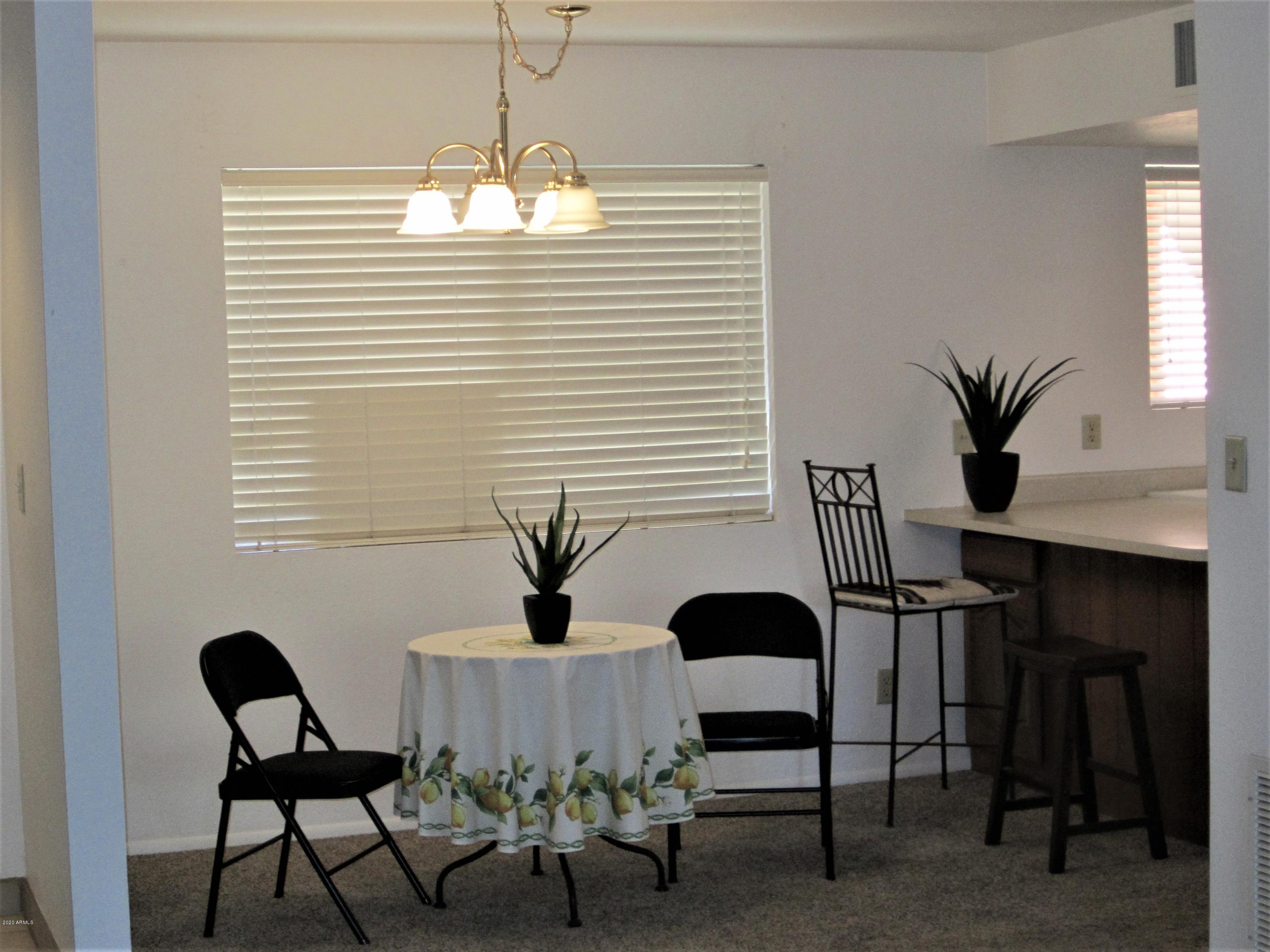 4303 East Cactus Road, Unit 406 Phoenix, AZ 85032 - Photo 2 of 27 B10 U406 DINING ROOM
