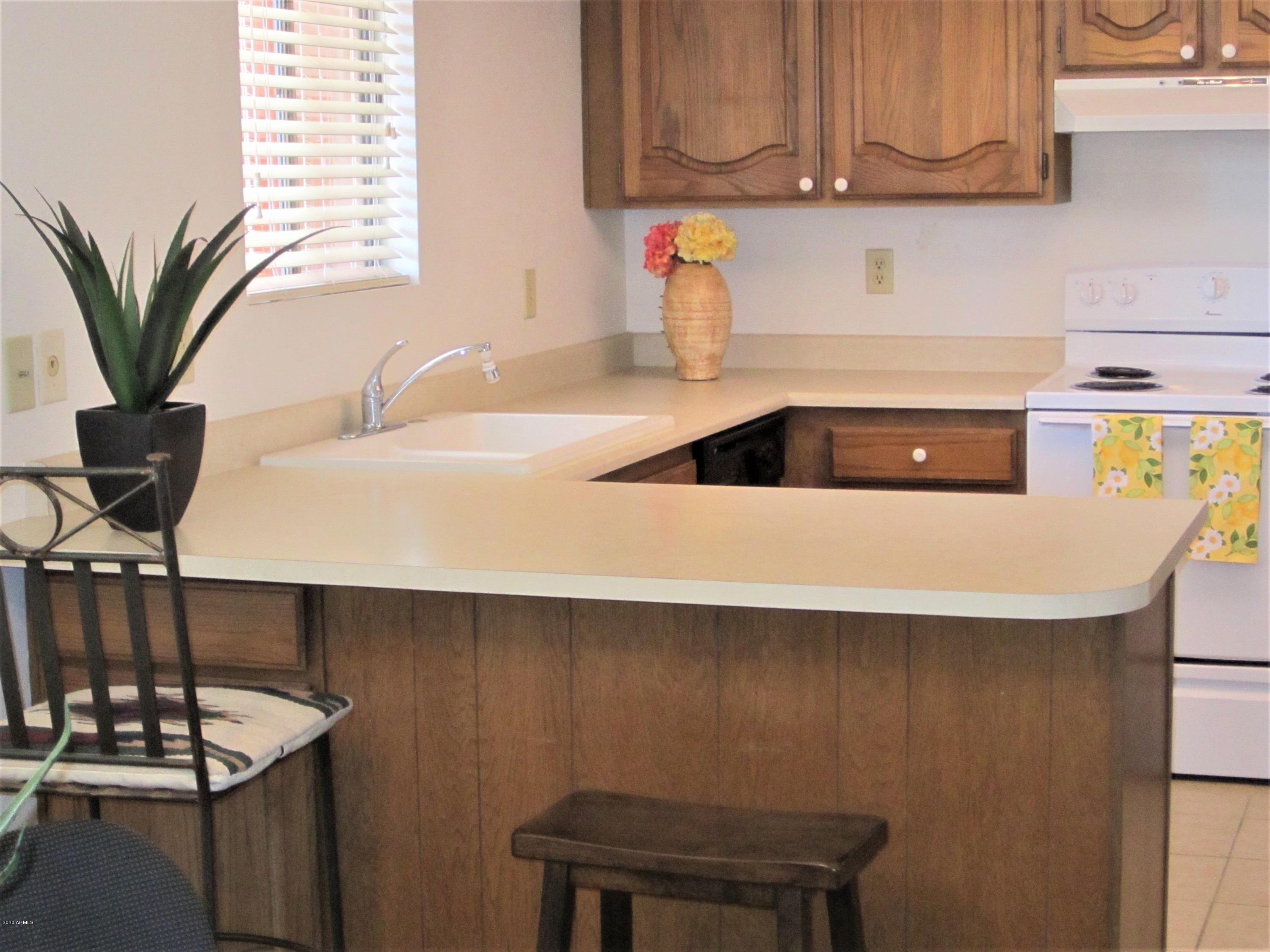 4303 East Cactus Road, Unit 406 Phoenix, AZ 85032 - Photo 3 of 27 B10 U406 AMPLE COUNTER SPACE