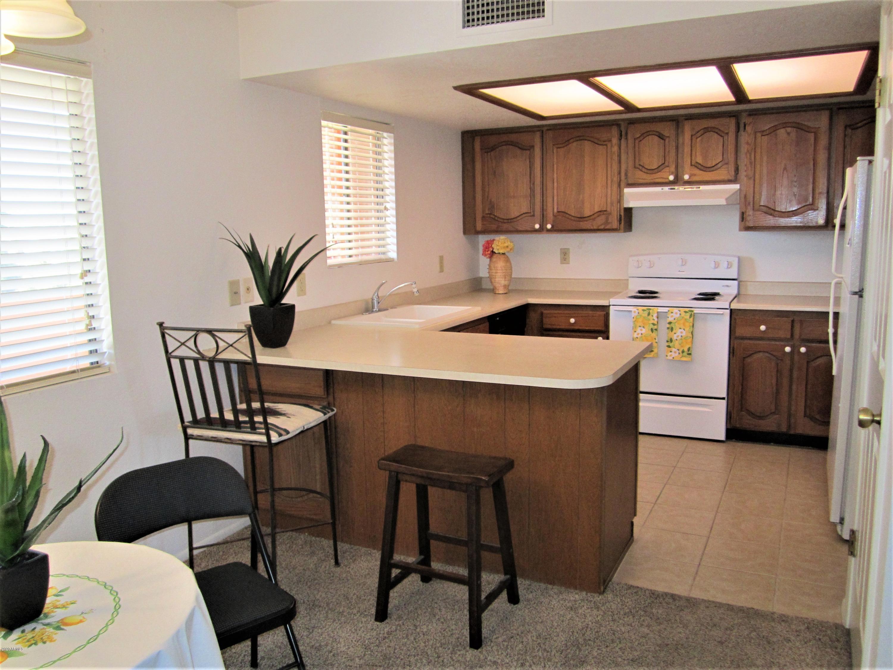 4303 East Cactus Road, Unit 406 Phoenix, AZ 85032 - Photo 5 of 27 B10 U406 KITCHEN & SNACK BARD