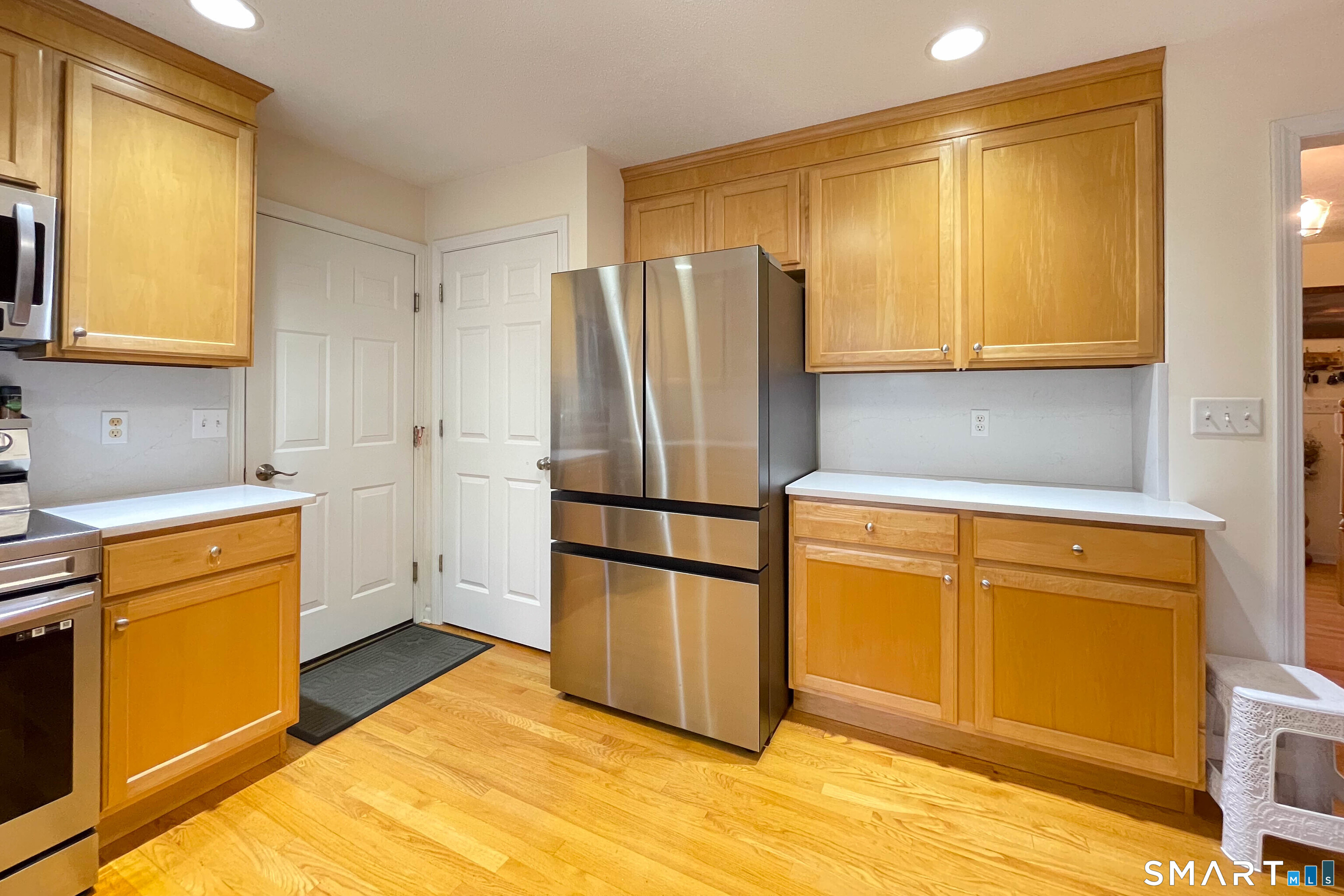 1 Bertini Lane Wallingford, CT 06492 - Photo 1 of 1 a kitchen with stainless steel appliances granite countertop a refrigerator and a stove top oven