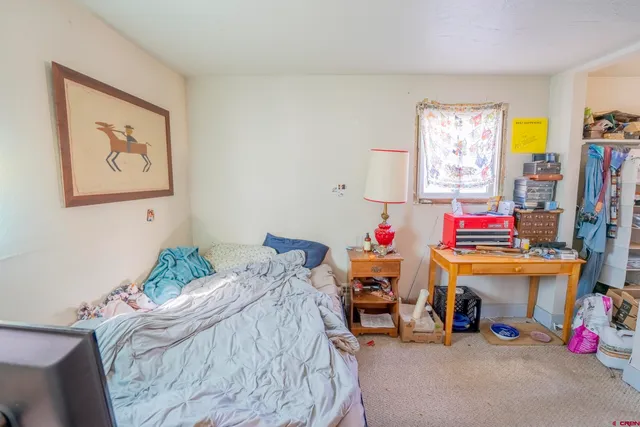 a very nice looking dining room with furniture and a chandelier