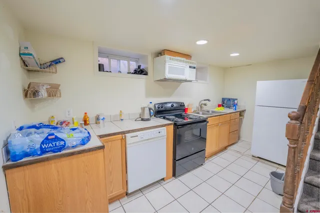 a bedroom with furniture and a baby crib