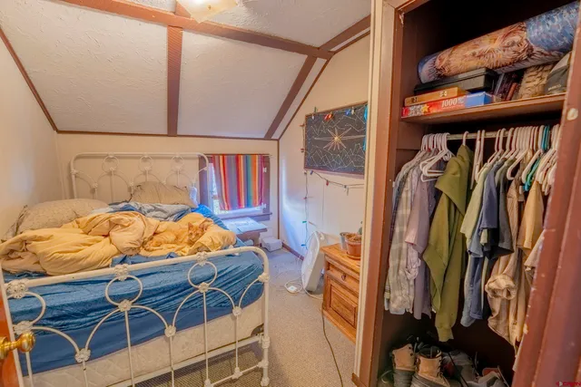 a view of a street with a building in the background