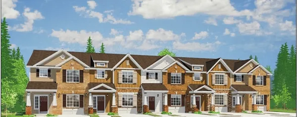 a view of multiple houses with a yard