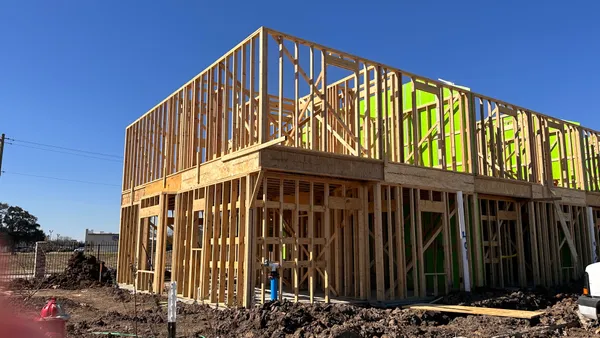 a view of staircase with railing and wooden fence