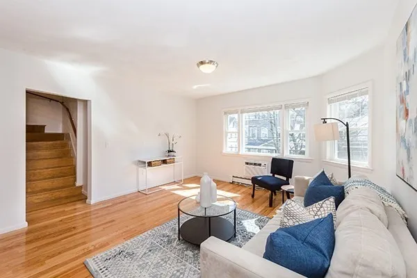 a living room with furniture and window