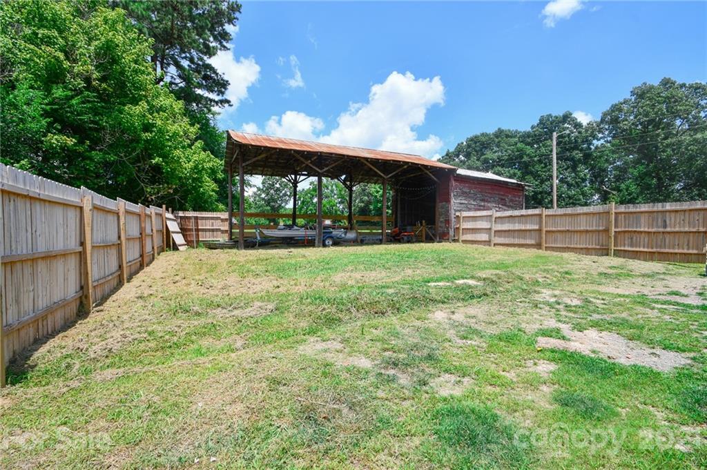 2503 Hargette Road Monroe, NC 28112 - Photo 2 of 11 a view of a backyard with a garden