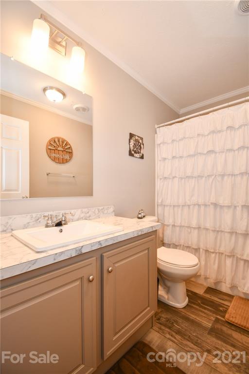 2503 Hargette Road Monroe, NC 28112 - Photo 11 of 11 a bathroom with a sink toilet and shower