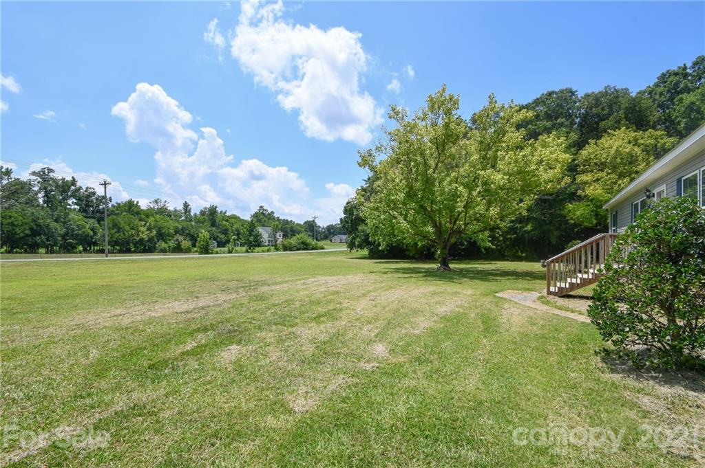 2503 Hargette Road Monroe, NC 28112 - Photo 3 of 11 a view of a golf course with a lake