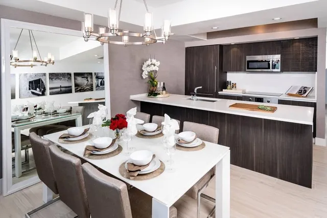 a kitchen with furniture and a kitchen island