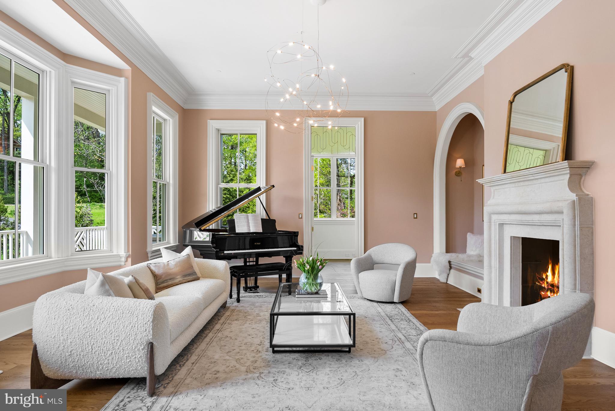 827 Turkey Run Road McLean, VA 22101 - Photo 3 of 6 a living room with furniture fireplace and large windows