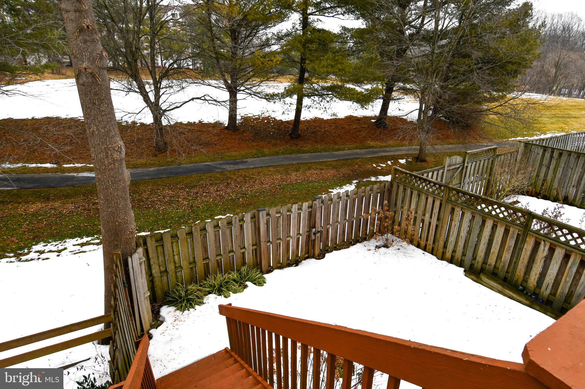 11796 Lone Tree Court Columbia, MD 21044 - Photo 15 of 45 a view of balcony with wooden floor and fence