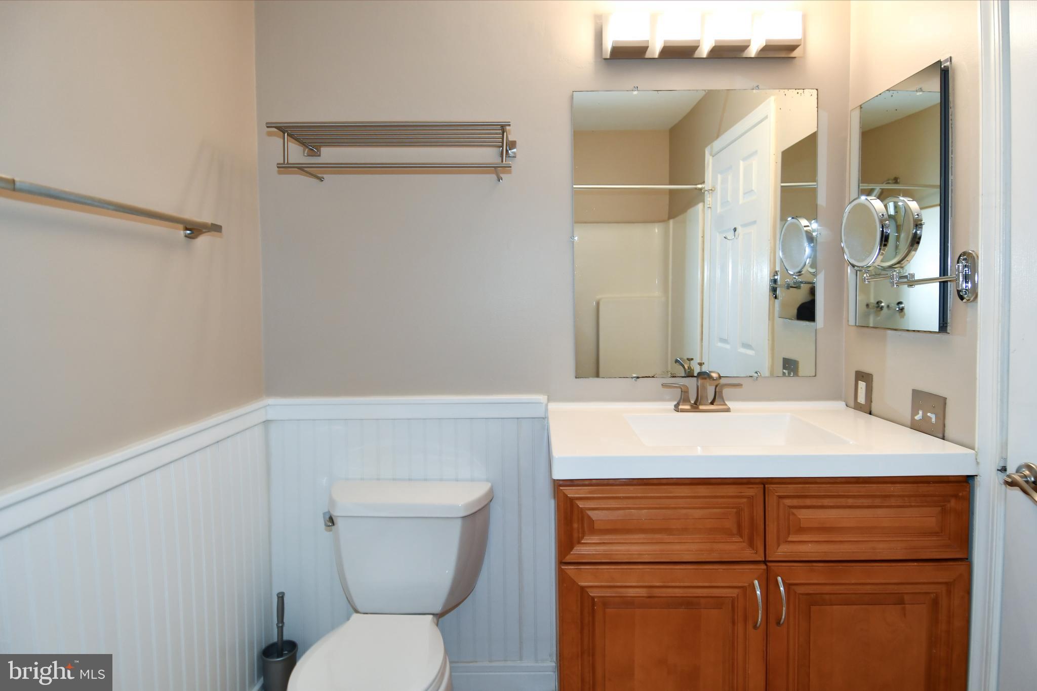 11796 Lone Tree Court Columbia, MD 21044 - Photo 19 of 45 a bathroom with a sink a toilet and a mirror